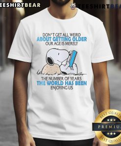 Alt Text: Cute Snoopy graphic on a t-shirt with the phrase Don't get all weird about getting older for a fun, playful look.