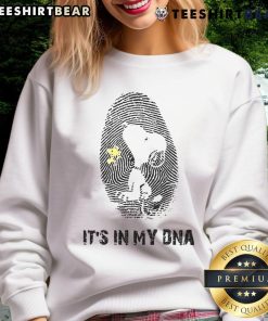 Alt Text: Cute Snoopy sweatshirt featuring 'It's in my DNA' design, perfect for fans of Peanuts and cozy fashion.