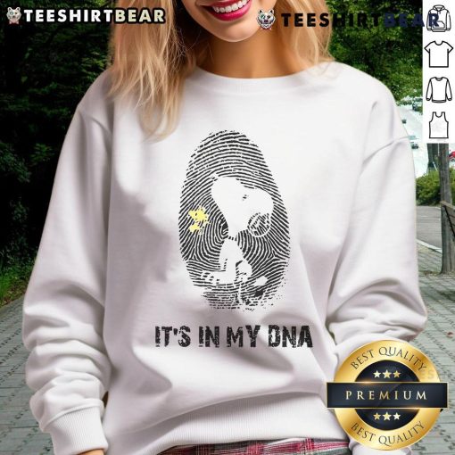 Alt Text: Cute Snoopy sweatshirt featuring 'It's in my DNA' design, perfect for fans of Peanuts and cozy fashion.