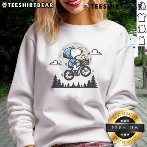 Cute Snoopy and Woodstock fly to the moon on a cozy sweatshirt, perfect for Peanuts fans and casual wear.