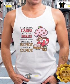Person wearing a 'Stop Eating Cakes With The Fakes' tank top, enjoying a Bundt cake at a cozy cafe.
