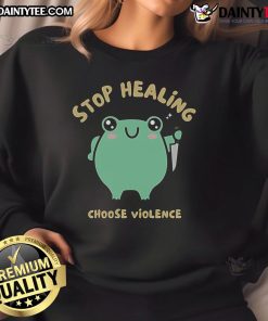 Adorable 'Stop Healing, Choose Violence' frog sweatshirt featuring a playful frog design in vibrant colors.