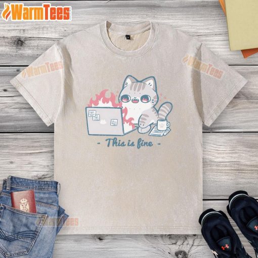 Alt Text: Cute cat in a 'This Is Fine' graphic tee working on a laptop, showcasing humor and pet fashion.