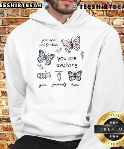 Cute hoodie with 'You Are Not Broken, You Are Evolving, Give Yourself Time' inspirational quote design.