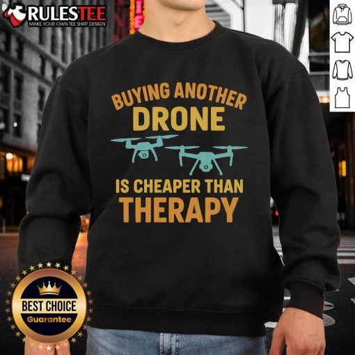 Funny sweatshirt saying 'Buying Another Drone is Cheaper Than Therapy' perfect for drone enthusiasts and humor lovers.