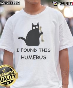 Alt Text: Funny cat wearing a shirt that says 'I Found This Humerus' showcasing humor and creativity in pet apparel.