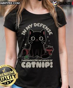 Alt Text: Funny cat in a humorous tee saying 'In My Defense, I Was Under The Influence Of Catnip' - perfect for cat lovers.