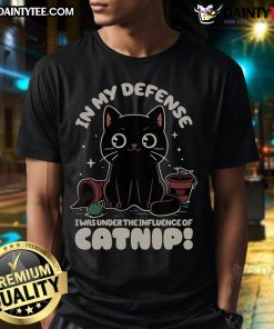 Funny cat wearing a In My Defense I Was Under The Influence Of Catnip t-shirt, showcasing playful feline humor.