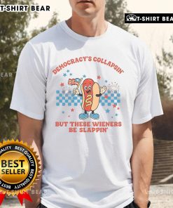 Alt Text: Funny Democracy Is Collapsing But These Wieners Be Slapping 4th of July protest T-shirt design featuring humorous graphics.
