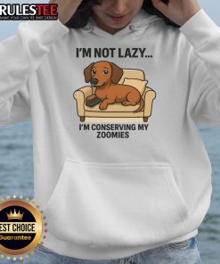 Funny dog wearing 'I'm Not Lazy, I'm Conserving My Zoomies' hoodie, showcasing a playful and relaxed attitude.