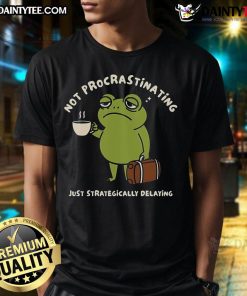 Funny frog on a t-shirt with text 'Not Procrastinating Just Strategically Delaying' in vibrant colors, perfect for humor lovers.