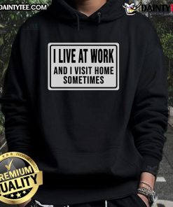 Funny 'I Live at Work and I Visit Home Sometimes' hoodie design in vibrant colors for casual wear.