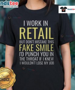 Funny ladies tee featuring 'I work in retail, but dont mistake this fake smile, I'd punch you in the throat' text design.