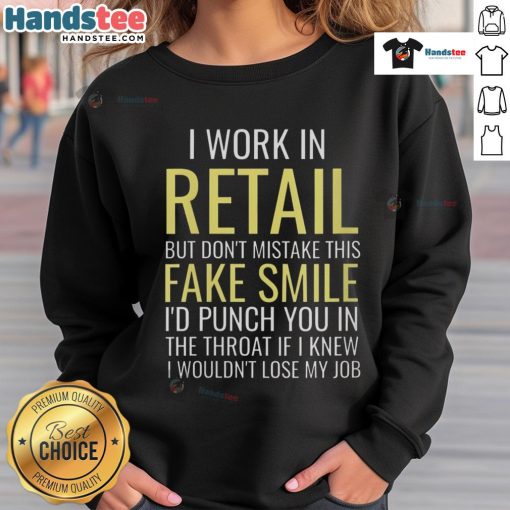 Alt Text: Funny 'I Work In Retail' sweatshirt with fake smile graphic, perfect for retail workers showcasing humor and personality.