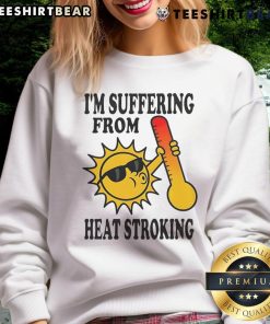 Funny sweatshirt saying 'I'm Suffering From Heat Stroke' with playful graphics, perfect for summer humor and relaxation.