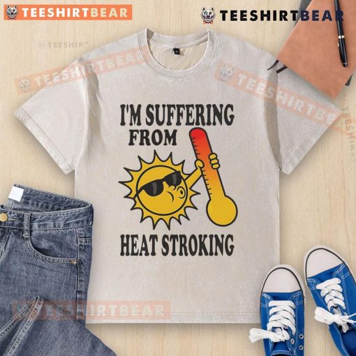 Funny 'I'm Suffering From Heat Stroke' washed t-shirt displayed on a mannequin, perfect for summer humor and casual wear.
