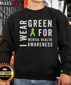 Alt Text: Funny In May We Wear Green sweatshirt with messy bun, promoting mental health awareness in vibrant colors.