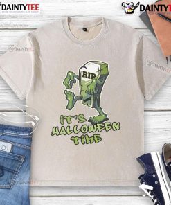 Funny RIP tombstone monster graphic on a washed Halloween time t-shirt for festive spooky style.