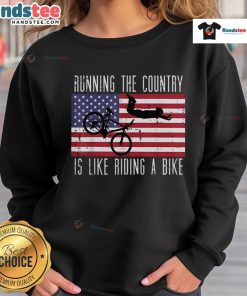 Funny running the country is like riding a bike sweatshirt, featuring humorous graphics and bold text design.