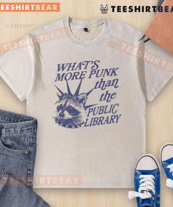Vintage raccoon graphic on a washed t-shirt, humorously asking 'What's more punk than the public library?'