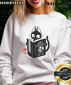 Funny World Domination for Cats book cover on a cute sweatshirt, perfect for cat lovers and humor enthusiasts.