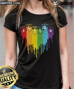 Colorful ladies tee featuring the autism acronym: Always Unique, Totally Intelligent, Sometimes Mysterious, with a rainbow drip puzzle design.