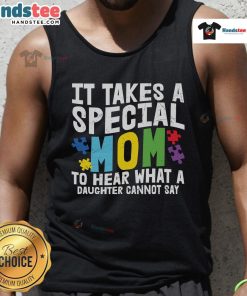 Mom wearing a heart-shaped tank top with a puzzle piece design, celebrating autism awareness and love for her daughter.