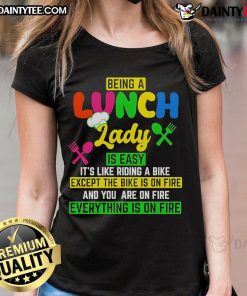 Funny ladies' tee featuring 'Being a lunch lady is easy, like riding a bike, except the bike is on fire' design.