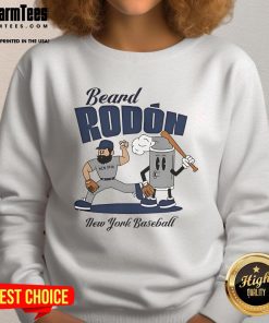 Carlos Rodon in a New York Yankees sweatshirt, showcasing his signature beard during mid-summer baseball.