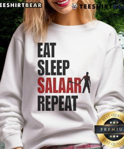 Front view of a stylish 'Good Eat Sleep Salaar Repeat' Indian action sweatshirt in vibrant colors on a model.