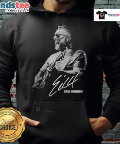 Eric Church performing at Red Rocks Amphitheater, featuring fans in 'Good' hoodies, capturing the concert atmosphere.