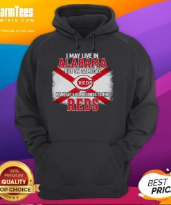 Person wearing a Reds hoodie, showcasing team spirit in Alabama on game day, highlighting loyalty to the Reds.