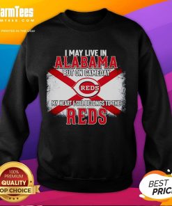 Comfortable 'Good I May Live In Alabama But On Gameday My Heart And Soul Belongs To Reds' sweatshirt displayed outdoors.