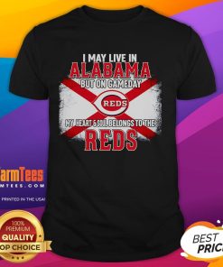 Good I May Live In Alabama But On Gameday My Heart And Soul Belongs To Reds T-Shirt displayed on a hanger.