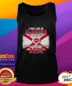 Woman wearing a 'Good I May Live In Alabama But On Gameday My Heart And Soul Belongs To Reds' tank top, cheering for her team.