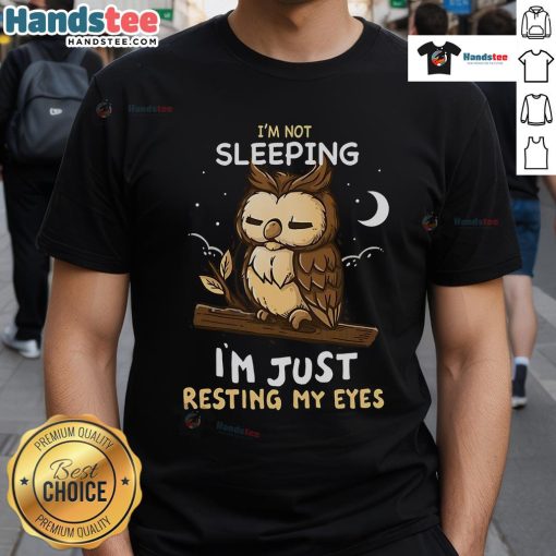 Alt Text: Funny 'Good I'm Not Sleeping I'm Just Resting My Eyes' T-Shirt design featuring playful typography on a casual tee.