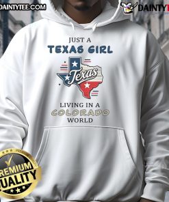 Good Just A Texas Girl Living In A Colorado World hoodie worn by a woman outdoors, showcasing Texas and Colorado pride.