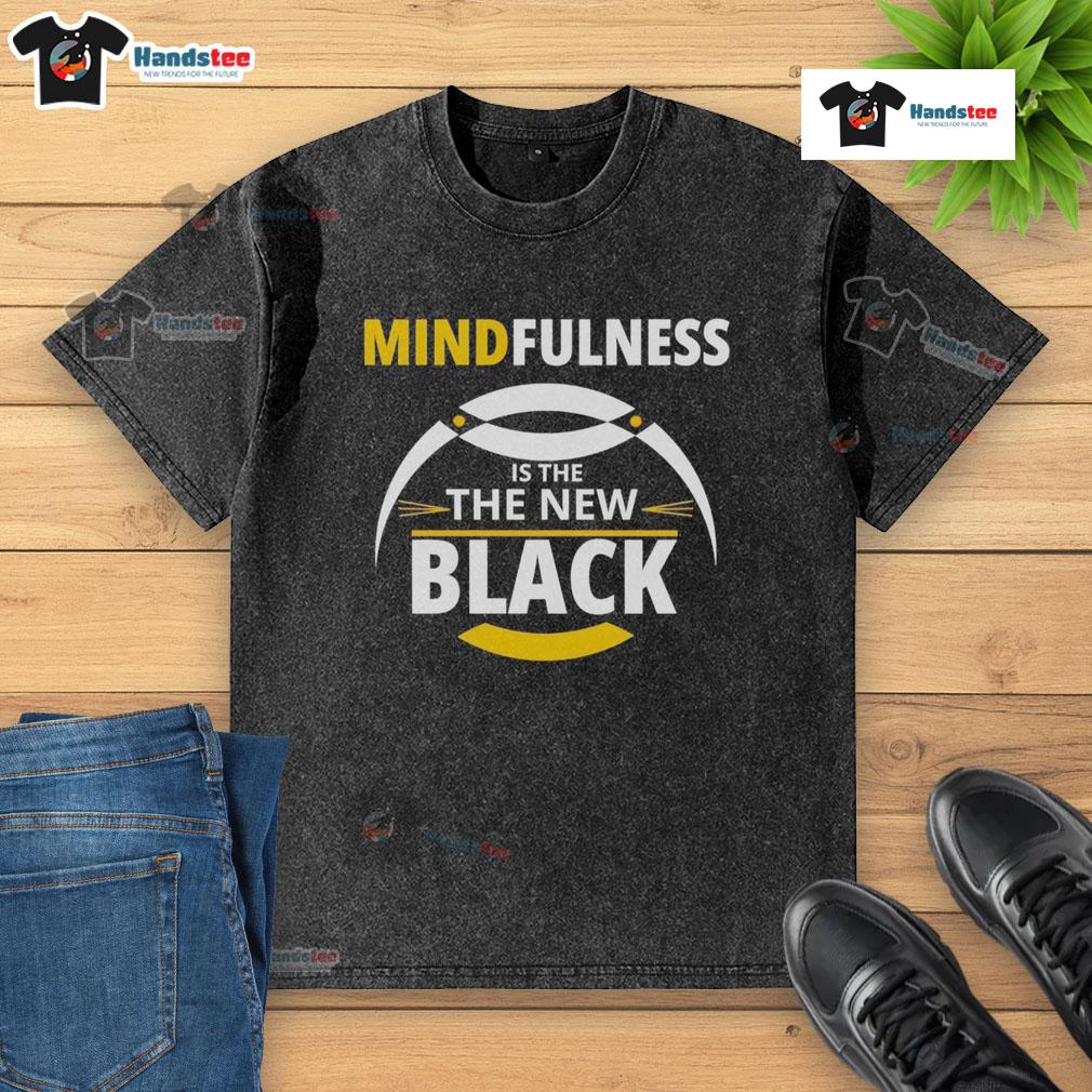 Good Mindfulness Is The New Black Washed T Shirt Good Mindfulness is the New Black washed t-shirt displayed on a hanger, showcasing a trendy design for mindful living.