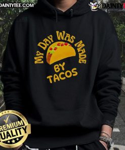 Cozy 'Good My Day Was Made By Tacos' hoodie displayed against a rustic backdrop, perfect for taco lovers.