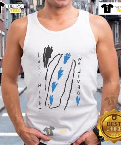 Alt Text: Woman wearing a Good Polar Last Night We Lived tank top, enjoying a vibrant summer day outdoors.