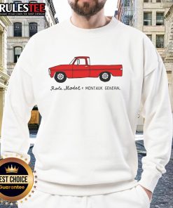 Good red truck parked near Montauk with model wearing X Role Model sweatshirt, showcasing stylish casual wear.