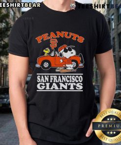 San Francisco Giants fans wearing a 'Good San Francisco Giants And Peanuts Posing Next To The Car' T-shirt at a game.