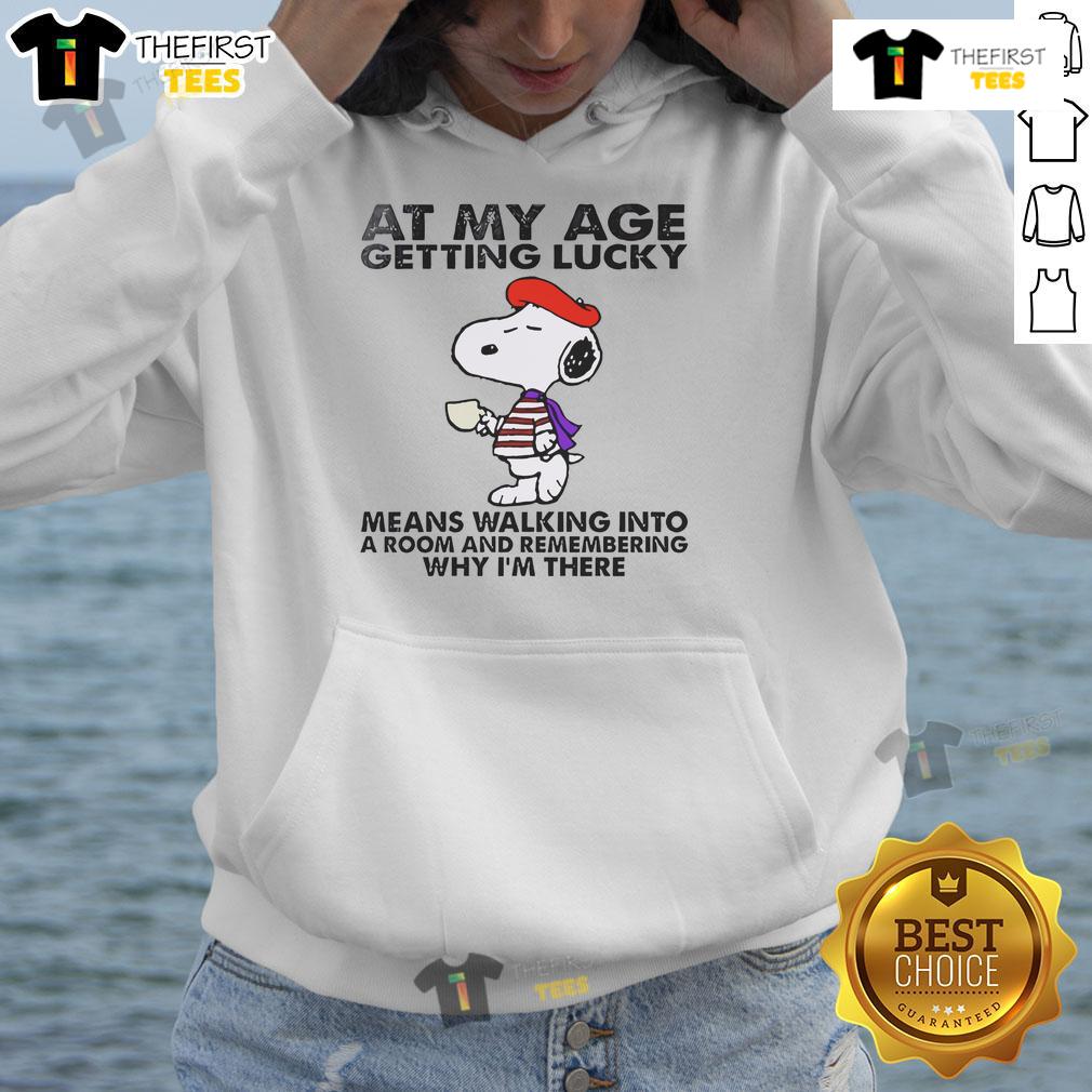 Good Snoopy At My Age Getting Lucky Means Walking Into A Room And Remembering Hoodie Good Snoopy hoodie featuring a humorous quote about aging and luck, perfect for casual wear and fans of Peanuts.