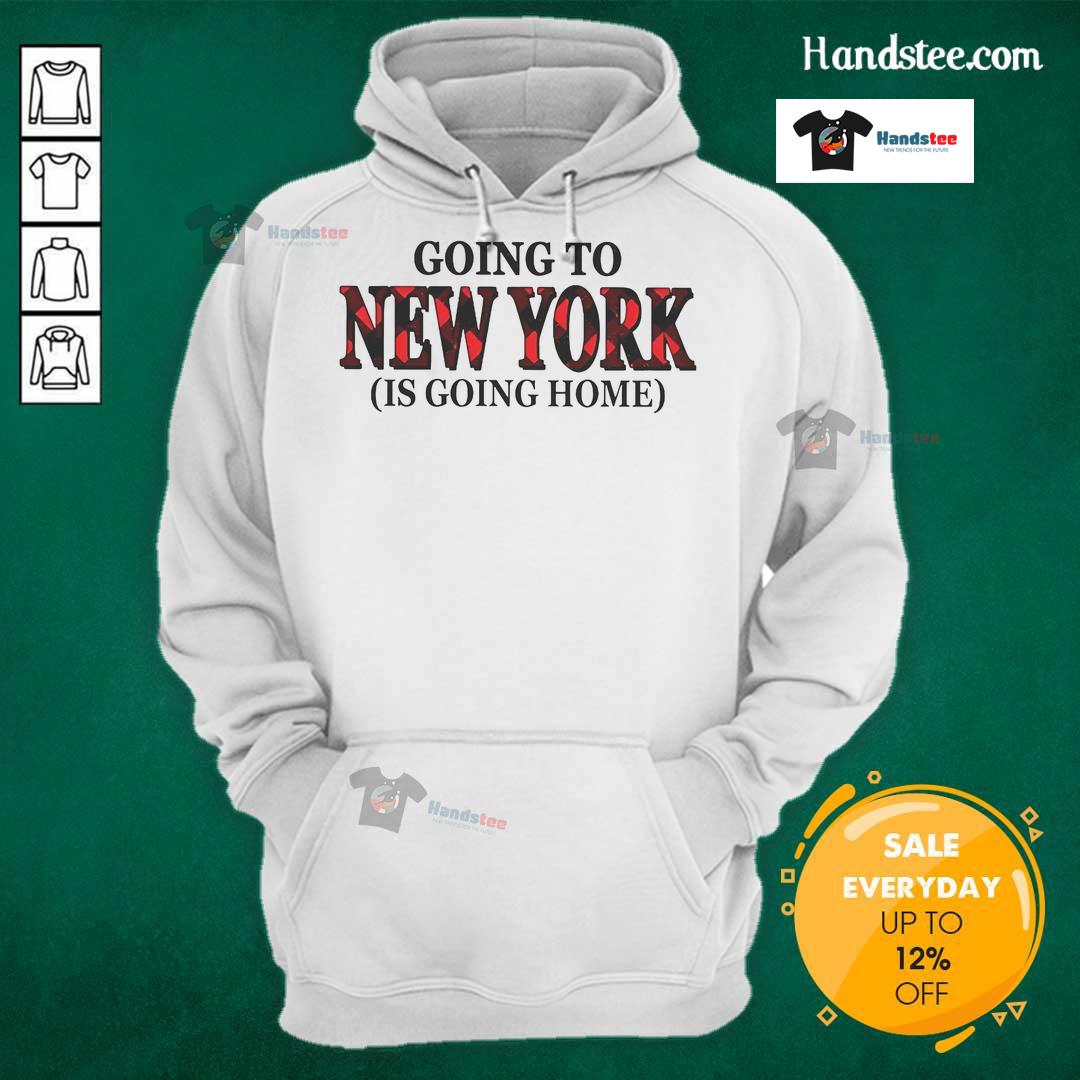 Happy Going To New York Is Going Home Hoodie Cozy Happy Going to New York is Going Home hoodie worn by a smiling person in a vibrant cityscape background.