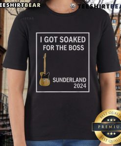 Alt Text: Happy woman wearing a Sunderland 2024 ladies tee, soaked and smiling, showcasing team spirit and joy.