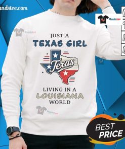 Alt Text: Happy Texas girl wearing a 'Just a Texas Girl Living in a Louisiana World' sweatshirt, smiling outdoors.