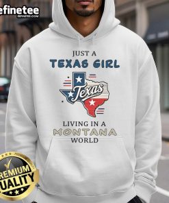 Happy Texas girl in Montana wearing 'Just a Texas Girl Living in a Montana World' hoodie, showcasing Western style.