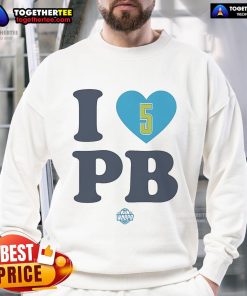 Paige Bueckers wearing a stylish I Love PB Dallas Wings sweatshirt, showcasing her love for basketball and team spirit.