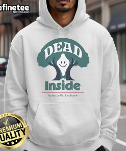 Riki Lindhome in a 'Dead Inside' play hoodie, smiling happily, showcasing the unique design and playful vibe.