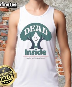 Riki Lindhome in a playful 'Dead Inside' tank top, smiling happily on stage during a performance.